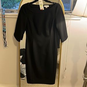 Calving Klein black dress.